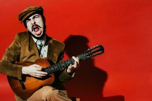 positive guy playing guitar in the Studio photo