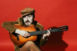 positive guy playing guitar in the Studio photo