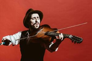 positive guy in the Studio simulates a violin photo