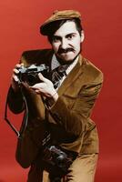 very positive photographer posing in studio with film camera photo