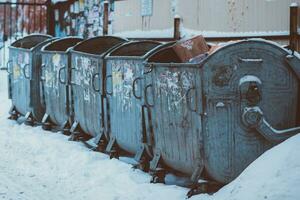 old metal trash cans are in the yard photo