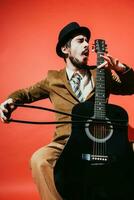 positive guy playing guitar in the Studio photo