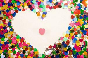 a heart shaped confetti heart on a white background photo