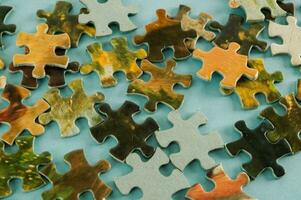 a puzzle pieces on a blue background photo