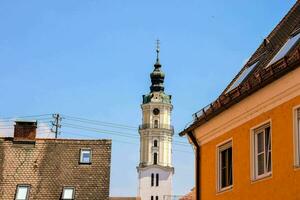 a clock tower in the middle of a town photo