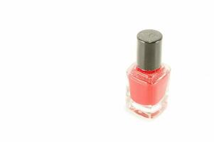 a bottle of red nail polish on a white background photo