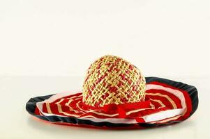 a straw hat with red, white and blue stripes photo