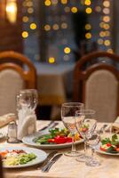 Served festive table with snacks, glasses, glasses, cutlery and napkins for a banquet photo