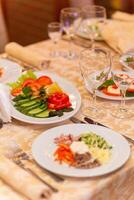 Served festive table with snacks, glasses, glasses, cutlery and napkins for a banquet photo