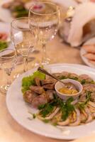 Served festive table with snacks, glasses, glasses, cutlery and napkins for a banquet photo