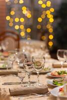 Served festive table with snacks, glasses, glasses, cutlery and napkins for a banquet photo