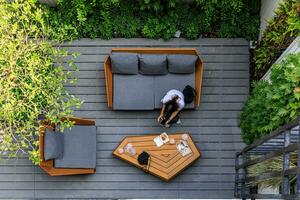 Birds eye view, a scene at local building exterior where people relax by sitting photo