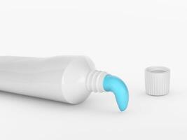 Squeeze toothpaste out of a toothpaste tube on a white background photo