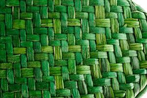 a close up of a green woven basket photo