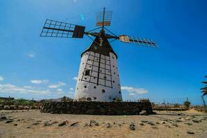 the windmill in the village of la cala de la rosa photo