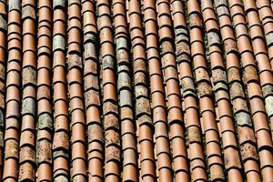 a close up of a roof with many different types of tiles photo