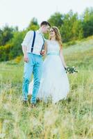 the bride and groom are photographed on the nature photo