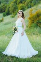 bride posing for the photographer on the nature photo