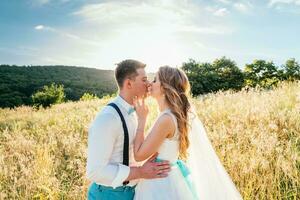 the bride and groom are photographed on the nature photo