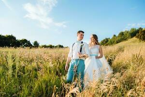 the bride and groom are photographed on the nature photo