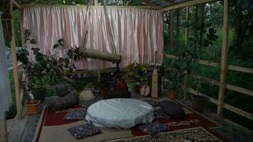 The interior of an old wooden house in the tropics. The view from the window. photo