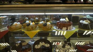 Cakes in a pastry shop in the city photo