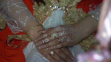 Hands of the bride and groom with wedding rings on their hands photo