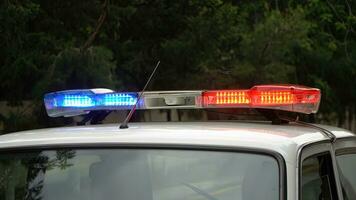 Police car flashing lights, closeup of photo with shallow depth of field