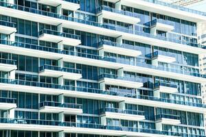 a large white building with blue windows photo