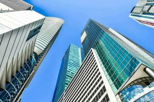 tall buildings in the city with a blue sky photo