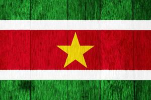 Flag of Republic of Suriname on a textured background. Concept collage. photo