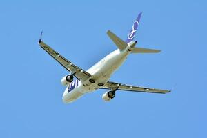 Warsaw, Poland. 15 April 2018.  Passenger airplane is flying from the runway of Warsaw Airport photo