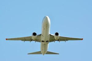 Warsaw, Poland. 15 April 2018.  Passenger airplane is flying from the runway of Warsaw Airport photo