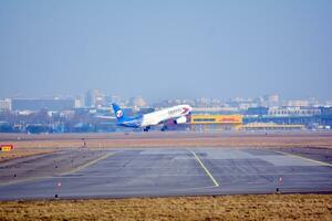 Warsaw, Poland. 5 March 2018. Passenger airplane just before landing at the Chopin airport. photo