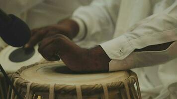 A set of drums being played at an Indian wedding video