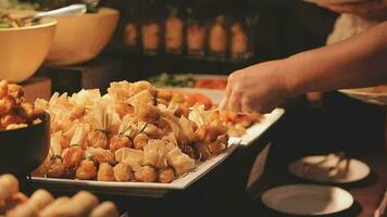 Food buffet catering lunch time seminar party with many hand of people in luxury restaurant video