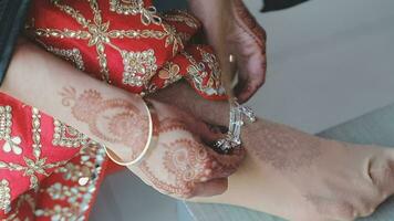 Closeup shot of women ankle wearing silver anklets. video