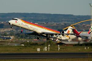 Iberia Airlines passenger plane at airport. Schedule flight travel. Aviation and aircraft. Air transport. Global international transportation. Fly and flying. photo