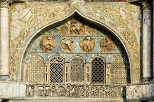 the facade of a building with ornate decorations photo