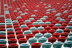 Background of empty red stadium chairs in a row. photo