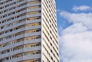 Condominium and apartment building with  symmetrical modern architecture in the city downtown. photo