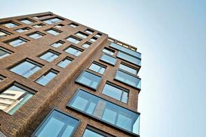 Condominium and apartment building with  symmetrical modern architecture in the city downtown. photo