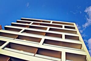 Condominium and apartment building with  symmetrical modern architecture in the city downtown. photo