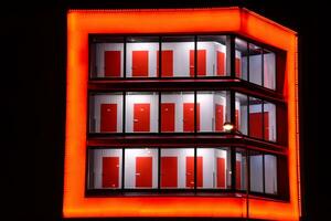 Pattern of office buildings windows illuminated at night. Glass architecture ,corporate building at night - business concept. photo