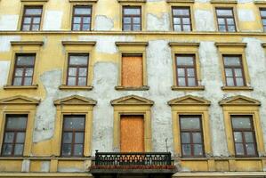 The historic house. Front wall of old tenement house photo