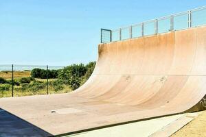 a skateboard ramp in the middle of a field photo