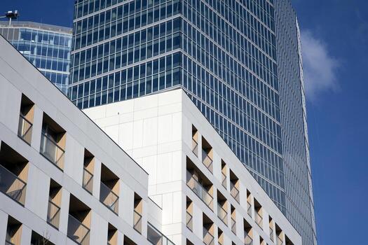 Condominium and apartment building with  symmetrical modern architecture in the city downtown. photo