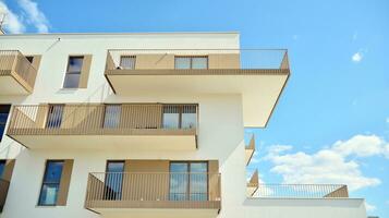 Condominium and apartment building with  symmetrical modern architecture in the city downtown. photo