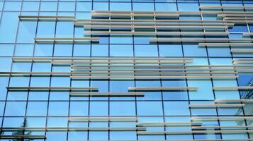 Urban abstract - windowed wall of office building. Detail shot of modern business building in city. photo