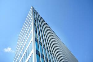 Urban abstract - windowed wall of office building. Detail shot of modern business building in city. photo